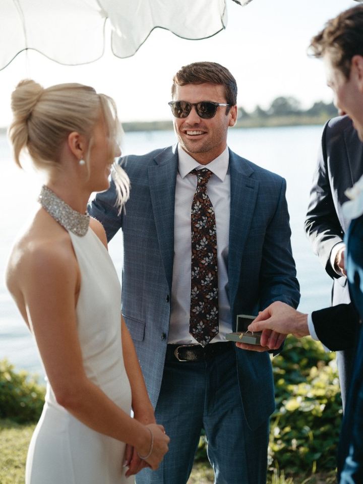 Tom at his wedding ceremony by the water